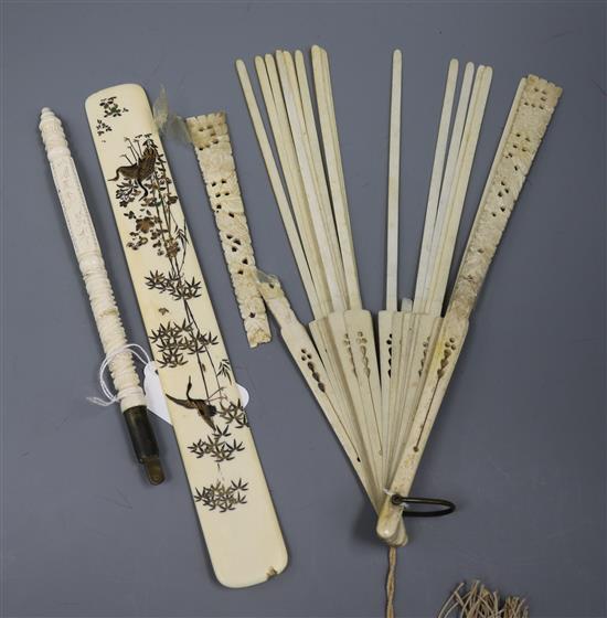 A Japanese ivory page turner, ivory umbrella handle and fan
